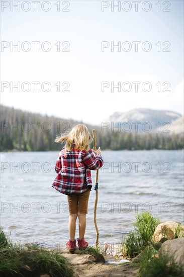 USA, Utah, Midway, Rear view of boy (6-7) standing by lake