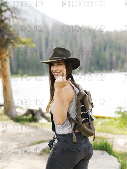 Portrait of woman hiking by lake