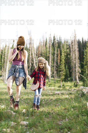 Mother with son (6-7) hiking in forest