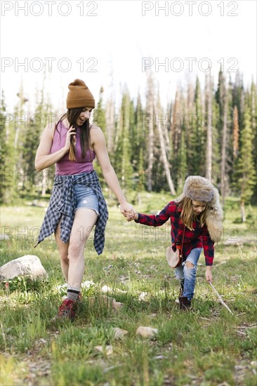 Mother with son (6-7) hiking in forest