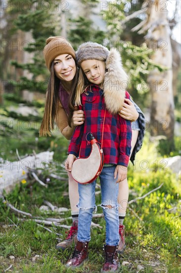 Portrait of mother with son (6-7) hiking in forest