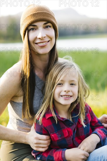 Portrait of mother and son (6-7) in meadow