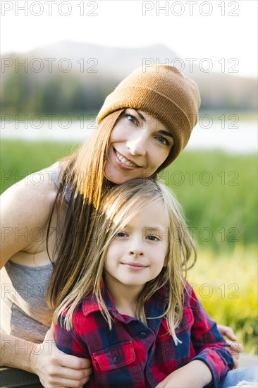 Portrait of mother and son (6-7) in meadow