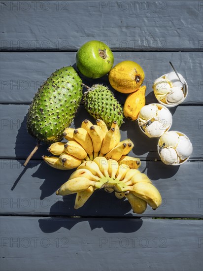 Fruit and ice creams on black floor