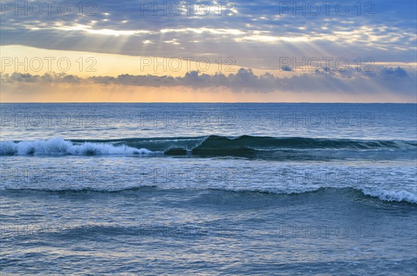USA, Florida, Ocean waves at sunset