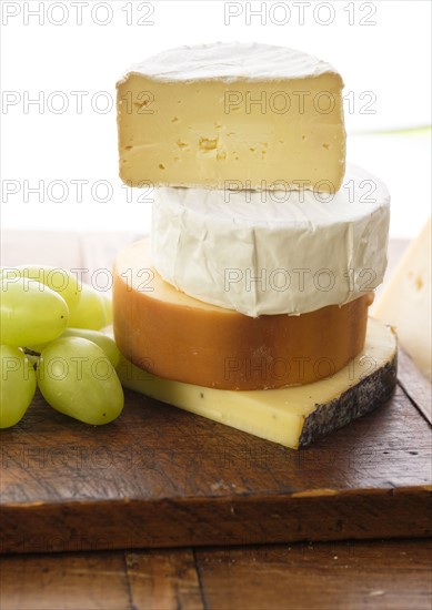 Assorted cheeses with grapes