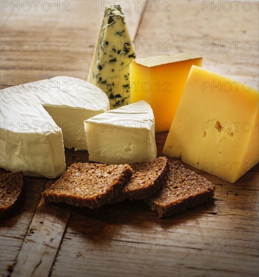 Assorted cheeses and bread slices