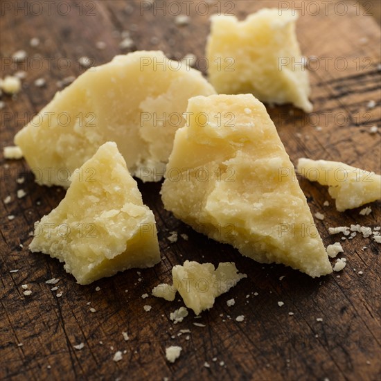 Parmesan cheese on wooden table