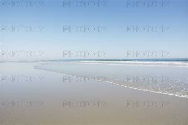 Empty beach on sunny day