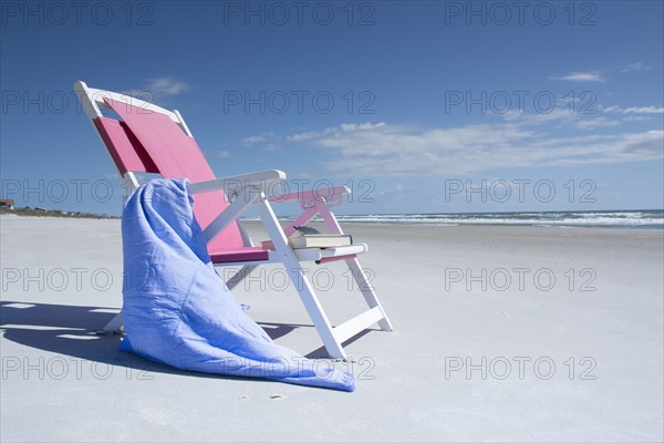 Deckchair on empty beach