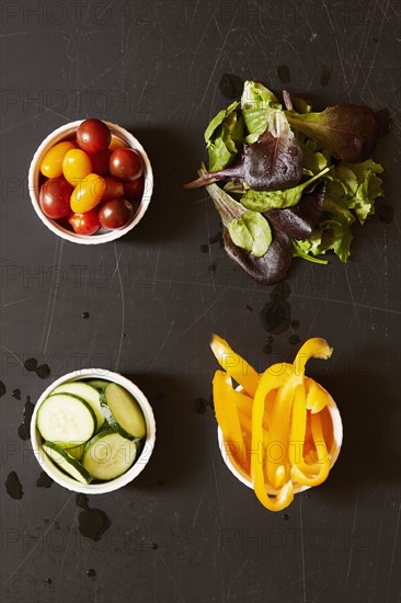 Yellow pepper, tomatoes, cucumber and greens