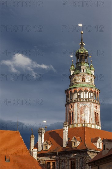 Czech Republic, South Bohemia, Cesky Krumlov, Castle tower against storm clouds