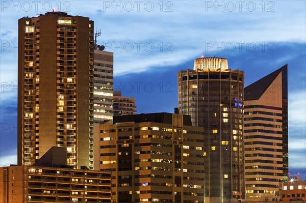 Canada, Alberta, Edmonton, Skyscrapers against moody sky