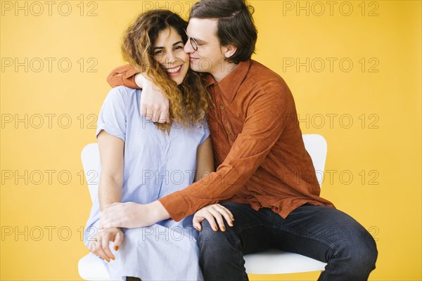 Couple embracing in studio