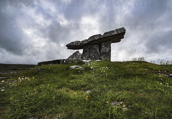 Ireland, Clare County, Burren, Poulnabrone Dolmen under overcast sky