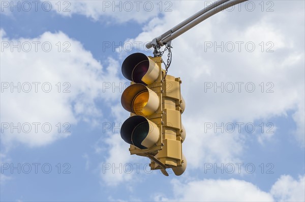 Traffic light against sky