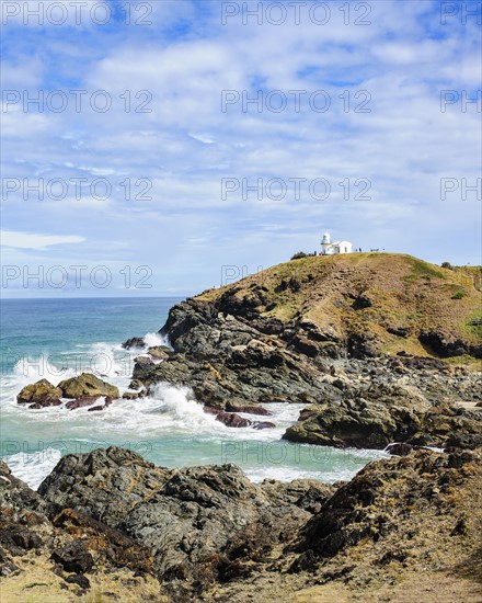 Australia, New South Wales, Cliff and lighthouse in background