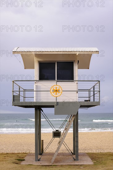 Australia, New South Wales, Lifeguard hut against storm clouds