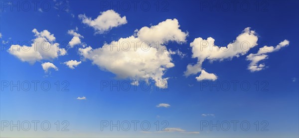 Fluffy clouds in blue sky