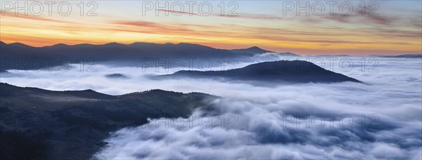 Ukraine, Zakarpattia region, Rakhiv district, Carpathians, Chornohora, Sheshul, Mist over mountains at dawn