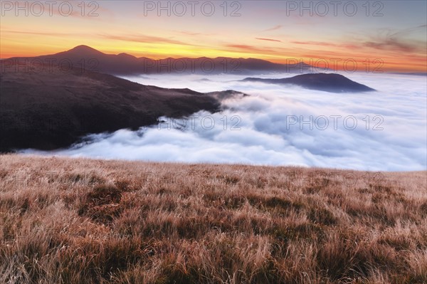 Ukraine, Zakarpattia region, Rakhiv district, Carpathians, Chornohora, Sheshul, Mist over mountains at dawn