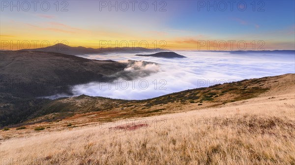 Ukraine, Zakarpattia region, Rakhiv district, Carpathians, Chornohora, Sheshul, Mist over mountains at dawn