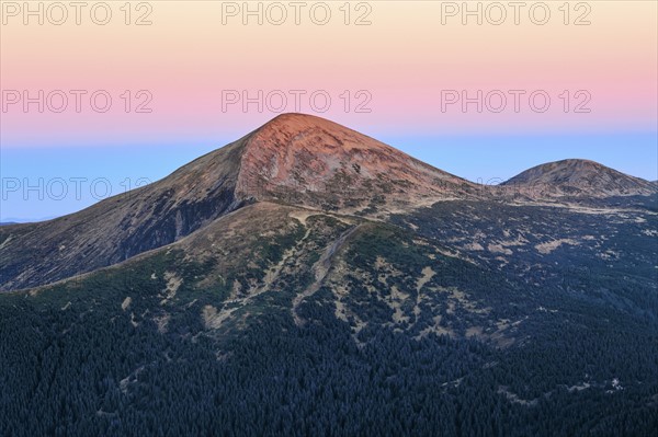 Ukraine, Zakarpattia region, Rakhiv district, Carpathians, Chornohora, Twilight over mountain landscape