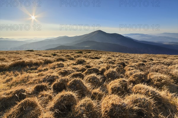 Ukraine, Zakarpattia region, Carpathians, Chornohora, mountain Petros, mountain Hoverla, Blue sky over field