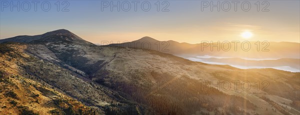 Ukraine, Zakarpattia region, Rakhiv district, Carpathians, Chornohora, Chornohora ridge, mountain Sheshul, Sunrise over mountain range