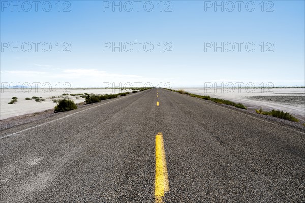 USA, Utah, Wendover, Bonneville Salt Flats, Blue sky over empty road