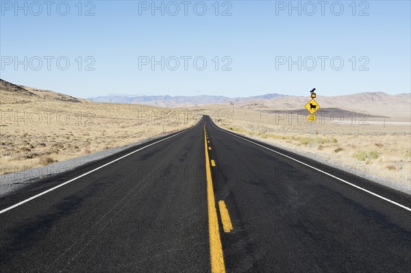 USA, Nevada, Highway 50, Clear sky over empty road