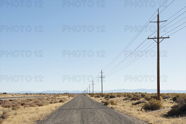 USA, Nevada, Highway 50, Electricity pylons next to road