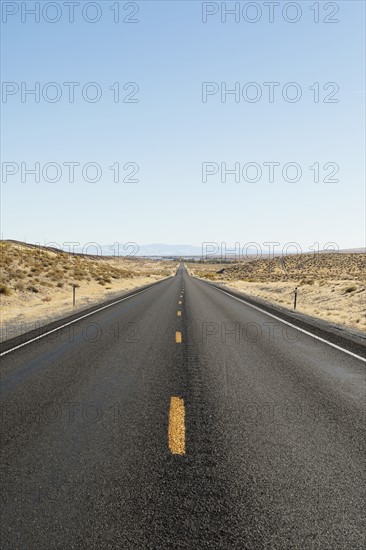 USA, Nevada, Highway 50, Clear sky over empty road