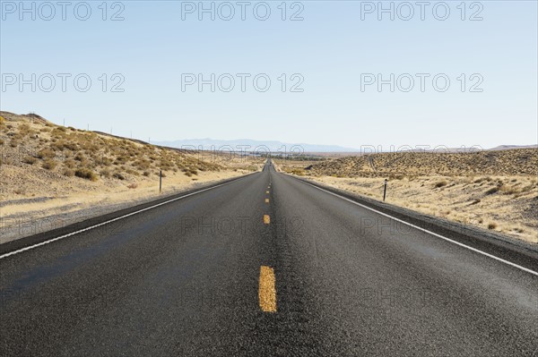 USA, Nevada, Highway 50, Clear sky over empty road
