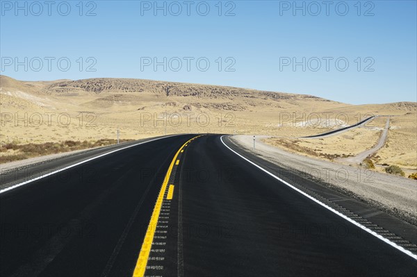 USA, Nevada, Highway 50, Clear sky over empty road