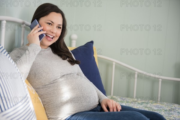 Pregnant woman using smart phone