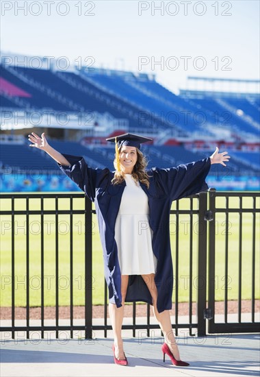 Portrait of graduate student in stadium