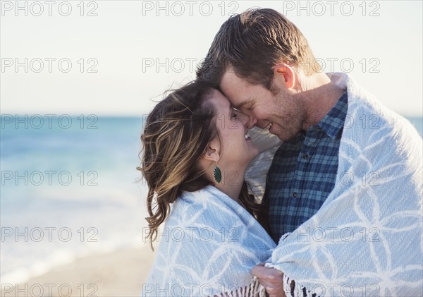 Couple embracing on beach