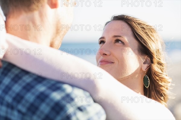 Couple embracing in beach