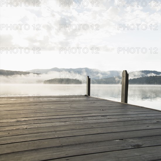 USA, New York, Lake Placid, Pier with foggy lake in background