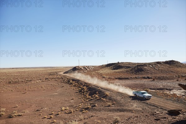 USA, Arizona, Pick up truck on dusty road