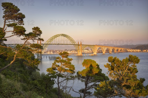 USA, Oregon, Newport, Bridge over river at sunset