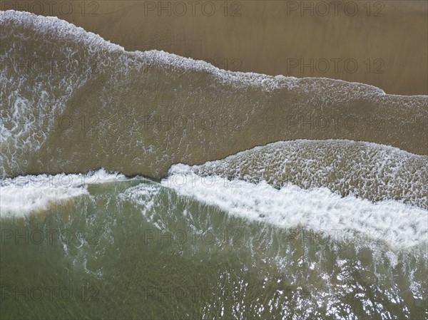 Aerial view of surfs on sea coast