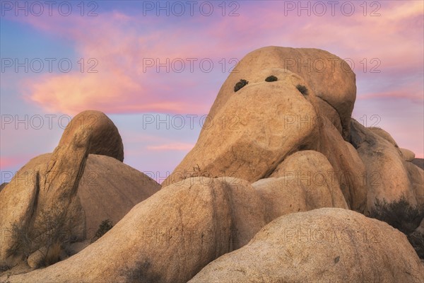 USA, California, Joshua Tree National Park, Rock formations at sunset