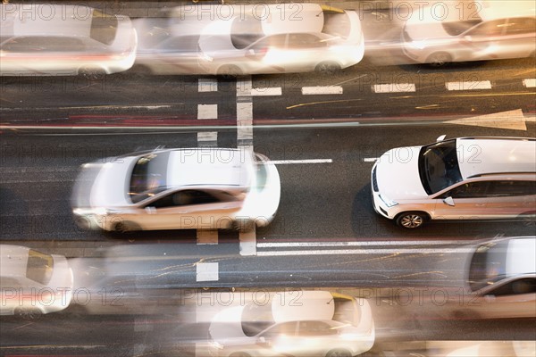 Spain, Madrid, Blurred motion of city traffic in Gran Via street from above