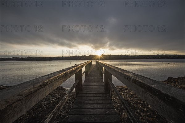 USA, Massachusetts, Eastham, Cape Cod, View from jetty on lake at sunrise