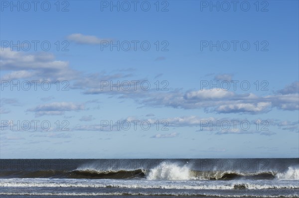 Sea waves splashing onto beach