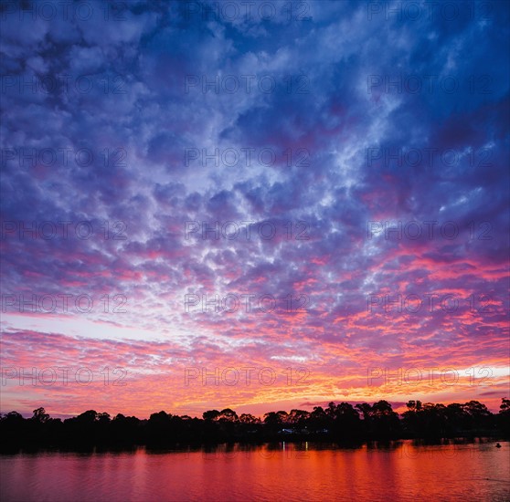 Australia, New South Wales, Bermagui, Scenic sunset above water