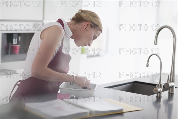 Woman preparing meal in kitchen