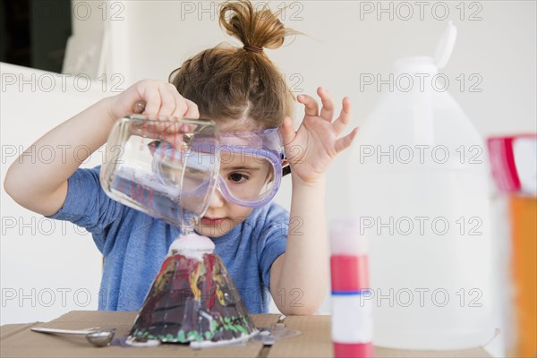 Girl making volcano